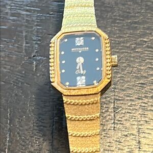 Wittnauer Gold and Black Watch. Needs batteries.